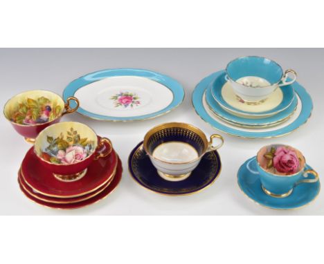 Aynsley decorative teaware comprising two trios, three cups and saucers and cake plate and four cups with interior floral dec