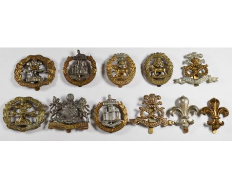 Eleven British Army Infantry cap badges including York and Lancaster Regiment, North Staffordshire Regiment, South Lancashire
