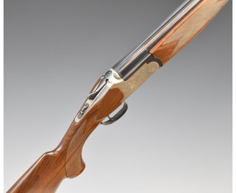 Fabarm 12 bore over and under ejector shotgun with engraved locks, top plate, thumb lever and underside, chequered semi-pisto