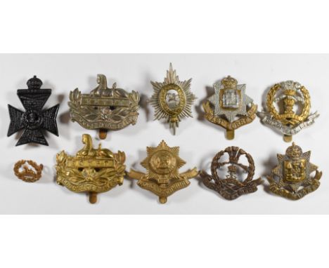 Ten British Army Infantry regiment badges including Gloucestershire Regiment, Worcestershire Regiment and Middlesex Regiment