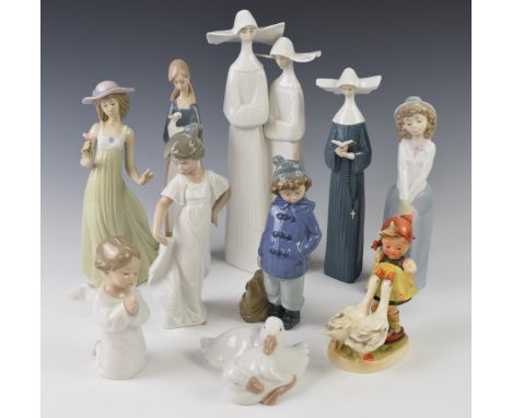 Nine Lladro and Nao figurines and an early Goebel Hummel figure, tallest 32cm