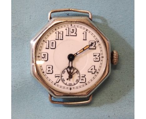 An early-20th century unsigned Swiss-made silver-cased trench wrist watch, with octagonal case, white enamel dial, Arabic num