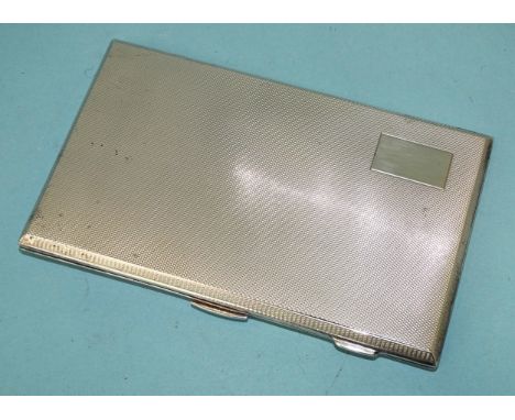 An engine-turned silver cigarette case with gilt interior, maker Bert Gordon, Chester 1946, 8.5 x 14cm, 216g, ___6.95oz.