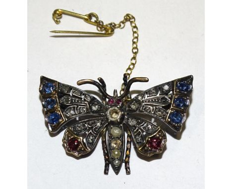A Victorian gem-set butterfly brooch, the wings set round-cut rubies and sapphires and rose-cut diamonds, with demi-pearl-set