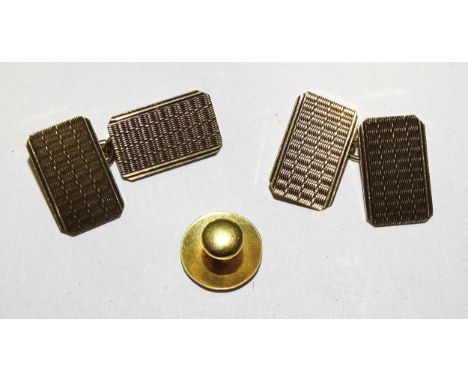 A pair of 9ct gold engine-turned cufflinks, 4.2g and an 18ct gold dress stud, 0.9g, (2).