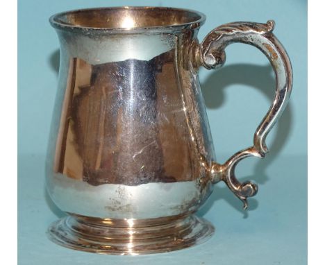 A George II silver half-pint tankard of baluster form, with leaf-capped scroll handle, inscribed maker's mark indistinct, Lon