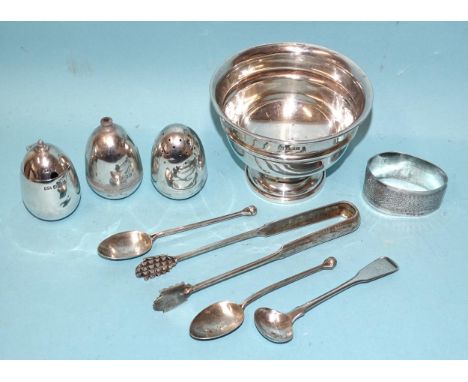 A circular silver bowl raised on circular foot, Birmingham 1962, a three-piece silver cruet with weighted bases, Sheffield 19