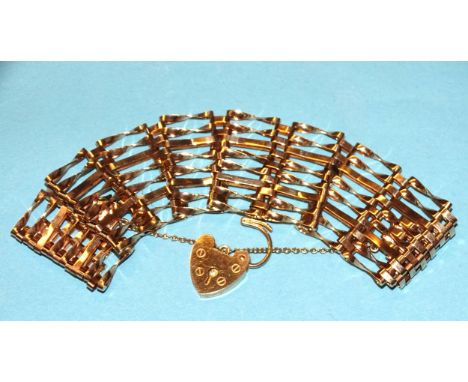 A 9ct gold gate-link bracelet, 28mm wide, with padlock clasp, 19cm long, 19.1g.