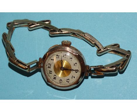 A lady's 9ct-gold-cased wrist watch on 9ct gold sprung bracelet, gross weight 19.4g, (winds and runs).