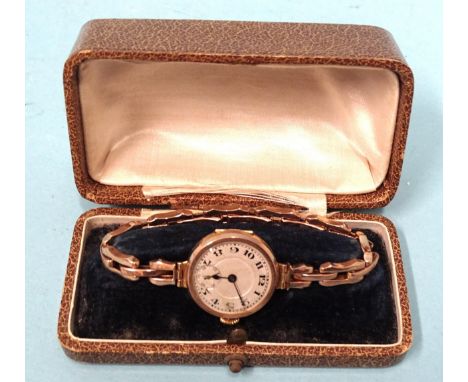 A lady's gold wrist watch, the silvered dial with Arabic numerals and seconds subsidiary, in 9ct gold case, on 9ct gold expan