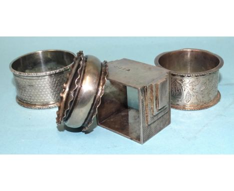 A heavy-gauge silver napkin ring of Art Deco form, ___2.5oz, 80.5g, London 1935, maker RWB and three other silver napkin ring