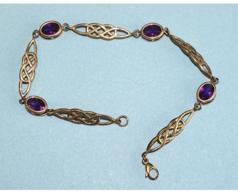 A 9ct gold bracelet collet-set oval amethysts joined by Celtic knot links, 20cm, 5.3g.