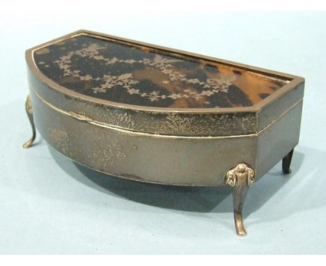 A silver and tortoiseshell trinket box, bow-fronted and raised on four scroll legs, the lid with piqué inlay of birds and gar