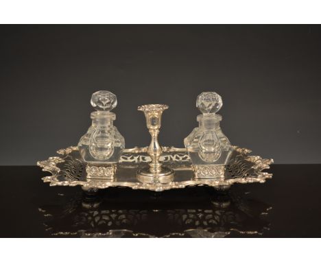 A Victorian silver desk stand, by Roberts & Hall, Sheffield 1850, scrolled and pierced outlines, integral chamber stick, fitt