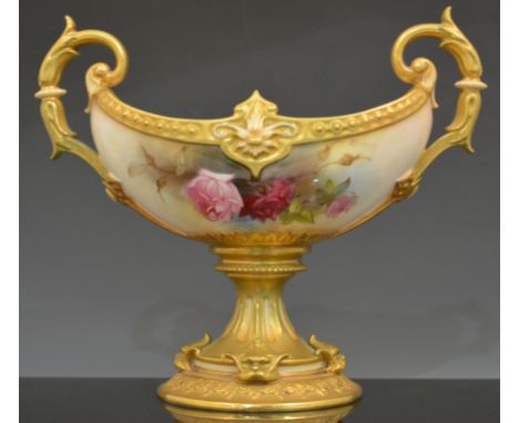 A Royal Worcester boat shape comport, date mark for 1914, twin scrolled handle, circular foot with mask heads, painted with r