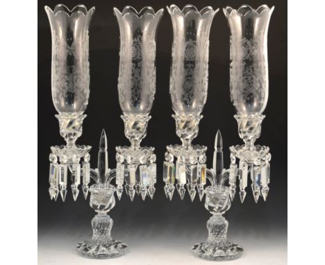 A pair of French glass two light table candelabra, Baccarat, bambou pattern with lustre drops each with a domed circular foot