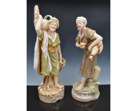 A Royal Dux figure of an Arab carrying a gourd and basin, number 441, 37cm and another Royal Dux figure of a bearded Arab, nu