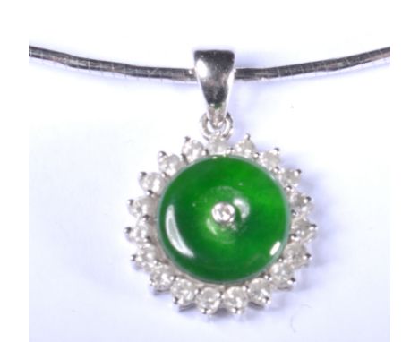 A white metal pendant and collar, the pendant with a circular cluster, jade centre with central diamond and border of diamond