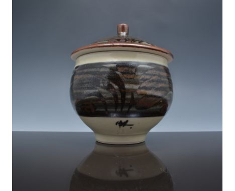 A Bernard Leach marmalade pot and cover, circa 1960, stoneware, cream ground with iron and blue painted designs to body and c