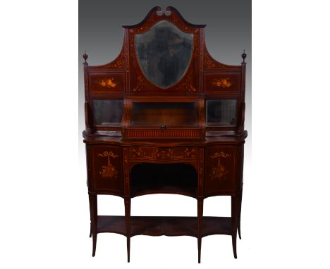 An Edwardian inlaid mahogany sideboard, in the style of Maple & Co., shield-shape mirror back under scrolls, with a hinged co