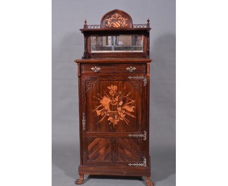 A Victorian rosewood and marquetry pier cabinet, shelf back with a marquetry flourished armorial under an arch, flanked by a 