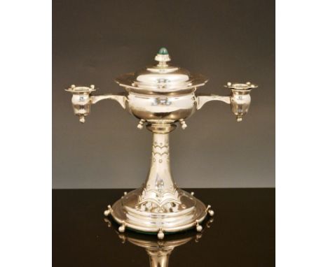 An English Arts and Crafts silver offering cup and cover, 1908,  the cup applied with twin arms supporting candle sconces, ra