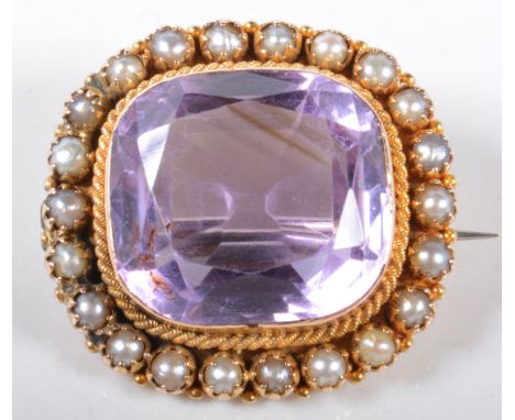 A yellow metal cushion shape brooch, collet set with an amethyst to centre, fine rope border, surrounded by half pearls, stam