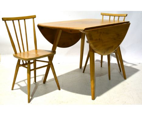 An Ercol drop leaf elm and beech oval dining table and five chairs, circa 1965, table design 384, together with five "All-pur