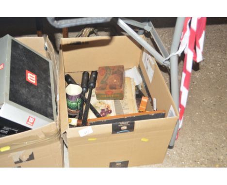 A box containing various mixed items to include three bagpipe attachments, a recorder etc
