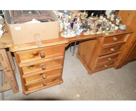 A modern pine dressing table fitted eight drawers 