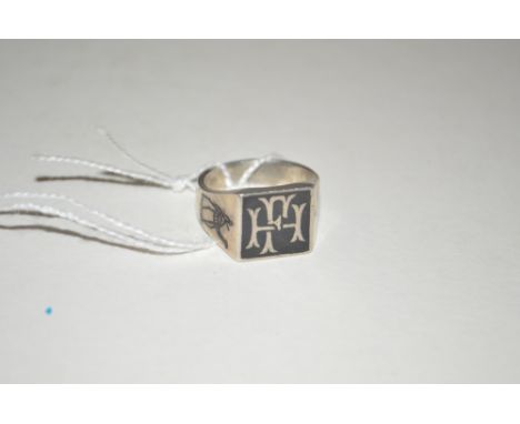 An Eastern white metal and Niello decorated signet ring