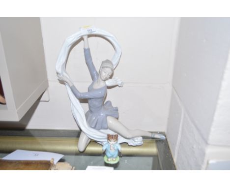 A Nao figurine of a dancer; and a Beswick Beatrix Potter figure in the form of Tom Kitten