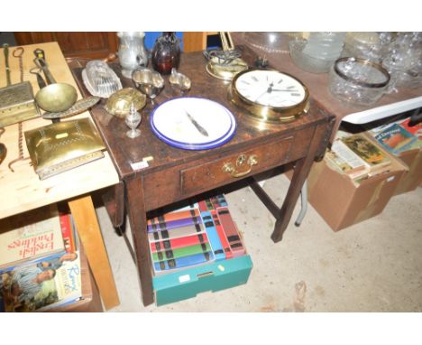 An oak drop leaf side table fitted single drawer