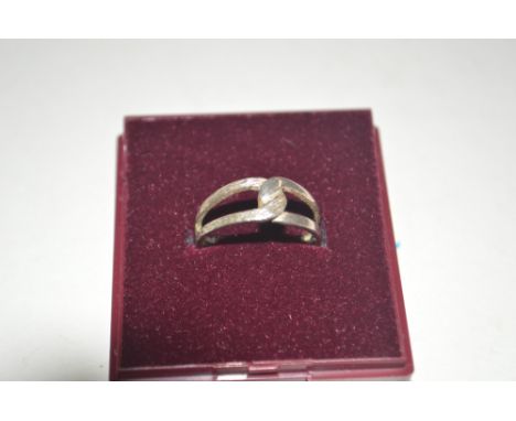 A silver dress ring (size N)