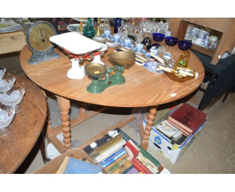 A modern pine drop leaf dining table 