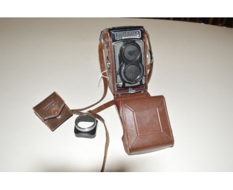 A Rollieflex camera with Carl Zeiss Tessar lens Serial No.2125008 with brown leather carrying case