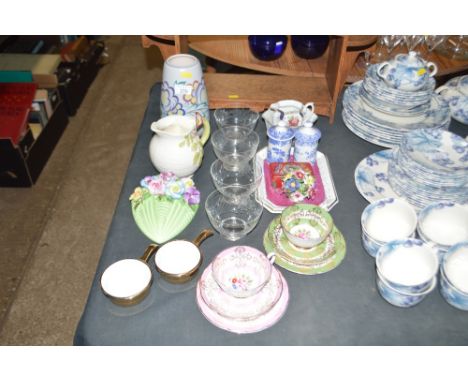 A Poole pottery vase; four glass sundae dishes; two Royal Grafton floral decorated trios; a Sylvac floral encrusted wall pock