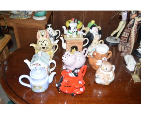 A collection of various novelty teapots to include a Carltonware example in the form of "The Red Barron"
