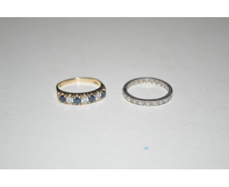 A 9ct gold sapphire and cubic zirconia set ring; and a platinum and diamond set eternity ring 