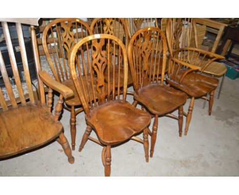 A set of six ash and elm stick back chairs to include two carvers and four standard