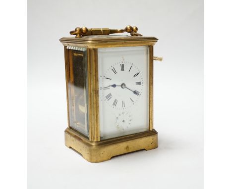 A brass carriage clock with subsidiary dial, 16cm high