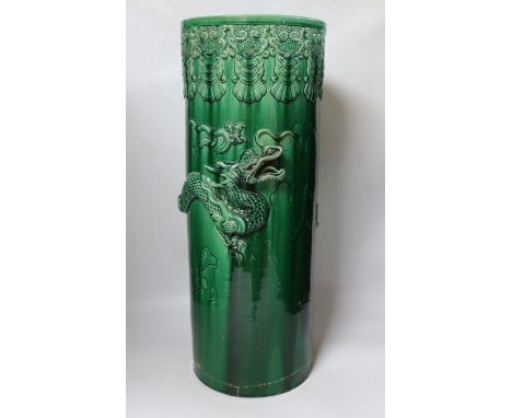 An early 20th century Japanese green glazed ‘dragon’ stick stand, 61cm