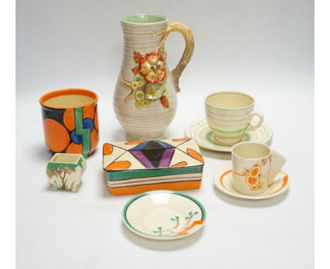 A Clarice Cliff Fantasque butter dish and cover, a Bizarre pot and five other Clarice Cliff items, tallest 20.5cm high