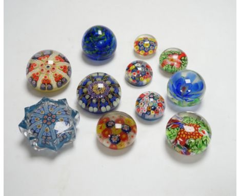 A collection of coloured glass paperweights including Strathearn, Caithness (28)