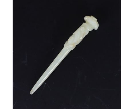 * * A Chinese pale celadon jade hair pin, Qing dynasty, carved in relief with a bird on a pine branch, the terminal with ling