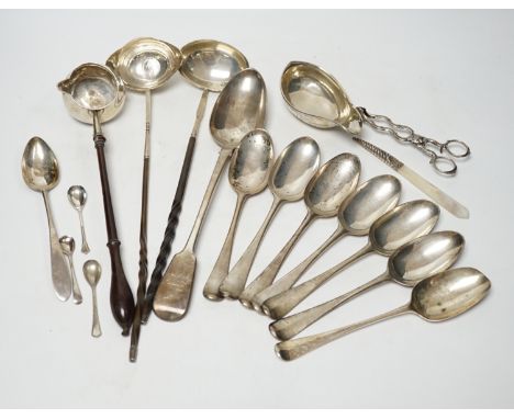 A late William IV silver fiddle pattern basting spoon, London, 1836, seven assorted 19th century silver base mark spoons, a G