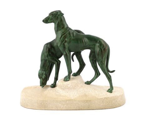 Masson, a French Art Deco spelter and composition stone group of two hounds watering, signed in the base, 32cm long, 12cm dee