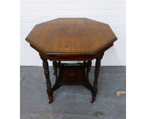 Edwardian rosewood and inlaid table with octagonal top, raised on turned legs with ceramic castors,  a square undertier, 76 x