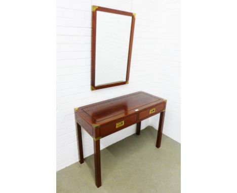 Hardwood console table with brass campaign style fittings, two drawers, 107 x 77 x 46cm together with a matching wall mirror,