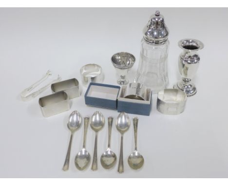 Four silver napkin rings with mixed hallmarks, an Epns napkin ring, set of six silver teaspoons, Sheffield 1943, silver sugar